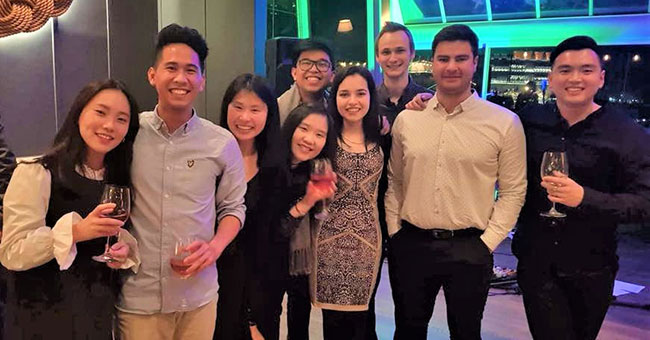 Group photo of Cherie at a Planit company party